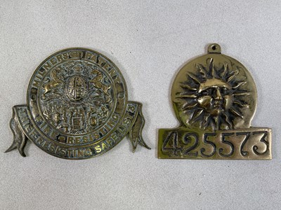Lot 55 - Two reproduction brass fire plaques,...