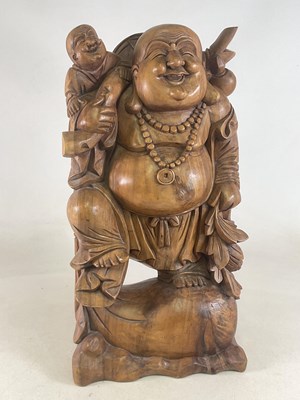 Lot 240 - A large carved wood merry monk figure, height...