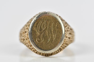 Lot 418 - A 9ct textured yellow gold signet ring, with...