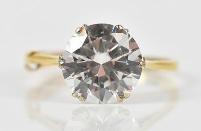 Lot 463 - An 18ct yellow gold solitaire dress ring set...