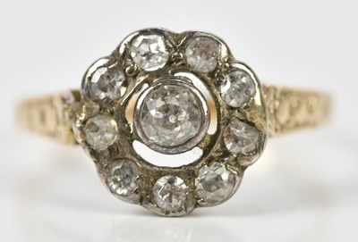 Lot 386 - A yellow metal diamond set daisy dress ring,...