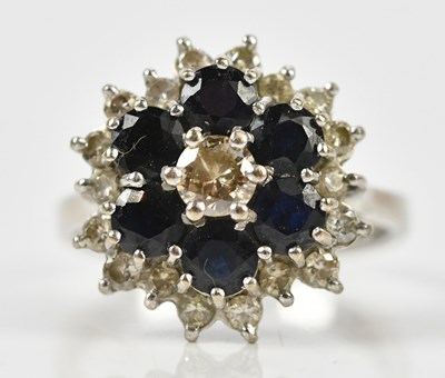 Lot 387 - An 18ct white gold diamond and sapphire set...
