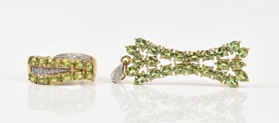 Lot 416 - A yellow metal dress ring set with a melee of...