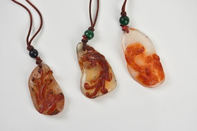 Lot 272 - Three Chinese carved hardstone necklaces, each...
