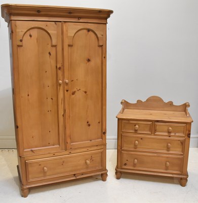 Lot 1032 - A pine wardrobe with drawer beneath cupboard...