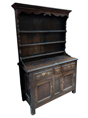 Lot 1080 - A 19th century oak dresser with plate rack,...