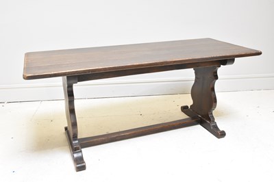 Lot 1050 - A reproduction oak refectory dining table,...