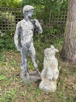 Lot 1222 - A reconstituted stone statue of nude male,...
