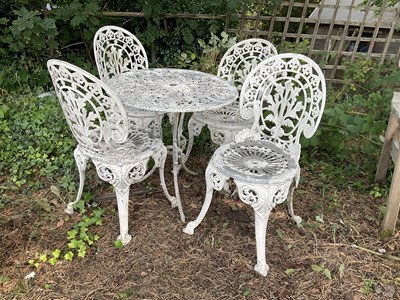 Lot 1229 - A white painted aluminium table and four...