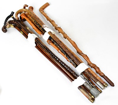 Lot 482 - A collection of fourteen walking sticks,...