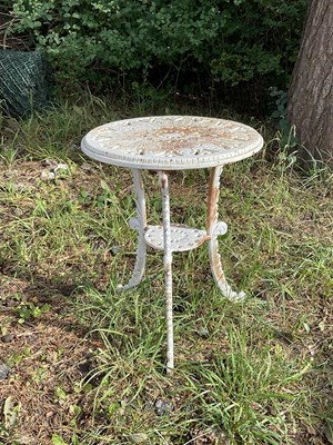 Lot 1237 - A white painted cast iron garden table, height...