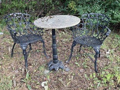 Lot 1225 - A reconstituted stone top and black painted...