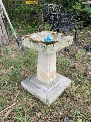 Lot 1232 - A reconstituted stone bird bath, height 46cm,...