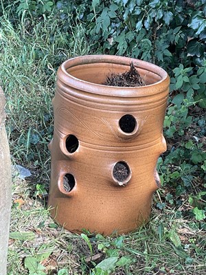 Lot 1245 - A terracotta strawberry pot, height 48cm,...