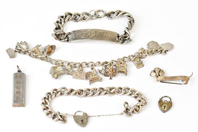 Lot 894 - A hallmarked silver pendant in the form of an...