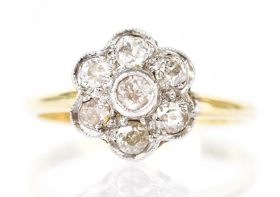 Lot 799 - An 18ct yellow gold ring, set with seven...