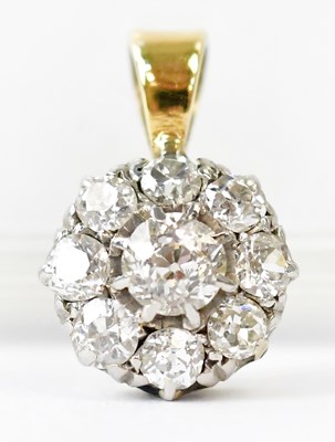 Lot 849 - An 18ct gold pendant with eight diamonds in a...