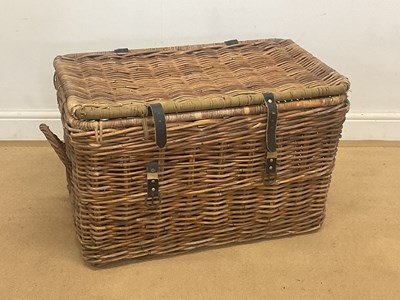 Lot 95 - A large wicker laundry basket with leather...