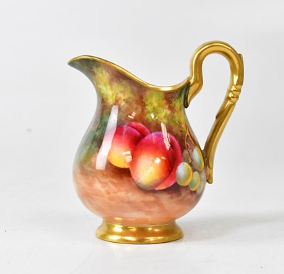 Lot 281 - ROYAL WORCESTER; a hand painted jug with gilt...