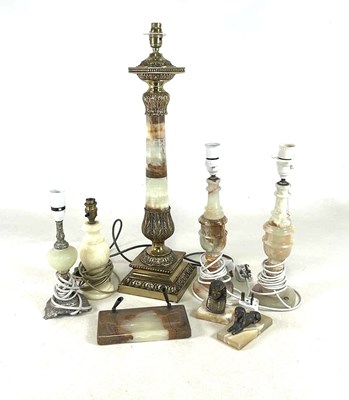 Lot 328 - A pair of onyx lamp bases, one larger and two...