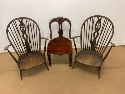 Lot 391 - ERCOL; a pair of elm and beech arm chairs,...