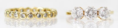 Lot 785 - An 18ct gold dress ring set with three cubic...
