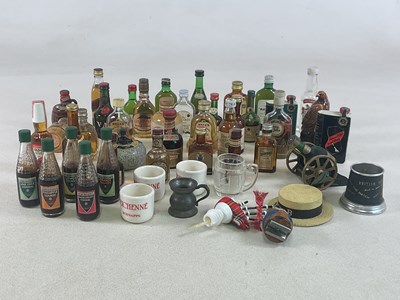 Lot 297 - MINIATURES; a quantity of whisky miniatures,...