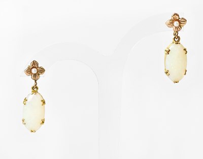 Lot 878 - A pair of yellow metal drop earrings set with...