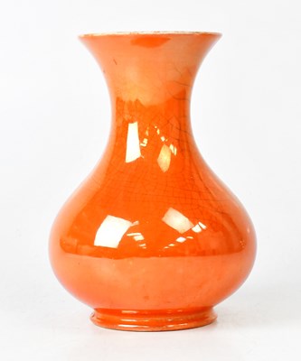 Lot 309 - MOORCROFT; an orange lustre craquelure vase of...