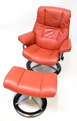 Lot 8 - EKORNES STRESSLESS; a red leatherette...