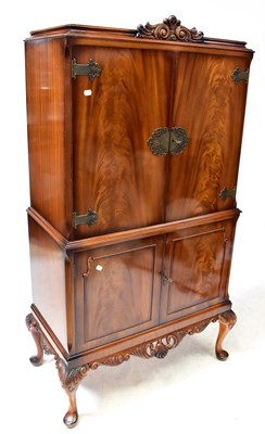 Lot 25 - A 20th century walnut Georgian-style drinks...