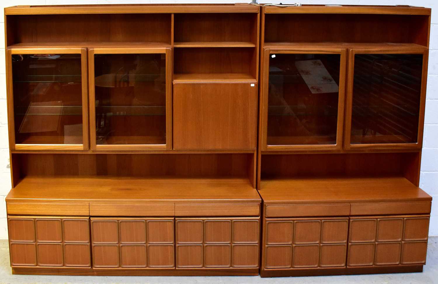 Lot 51 - MCINTOSH; two mid-20th century teak wall units,...