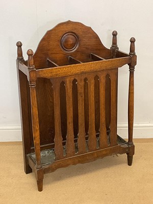 Lot 445 - An Arts and Crafts oak umbrella stand with tin...