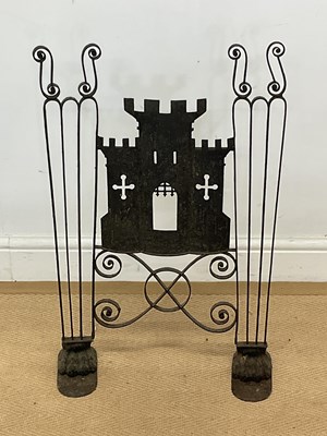 Lot 131 - A forged metal fire screen with a castle to...
