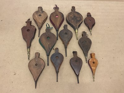 Lot 49 - A collection of wooden and leather bellows,...