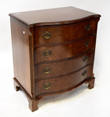 Lot 27 - A Georgian-style walnut serpentine chest of...