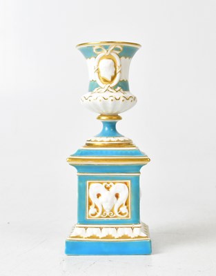Lot 292A - ROYAL WORCESTER; a porcelain urn on stand in...