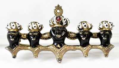 Lot 845 - A Blackamoor brooch depicting a row of five...