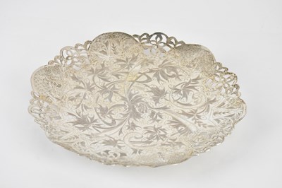 Lot 2352 - An Eastern white metal footed dish of shaped...