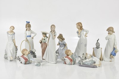 Lot 1589 - NAO; a collection of figures including cat on...