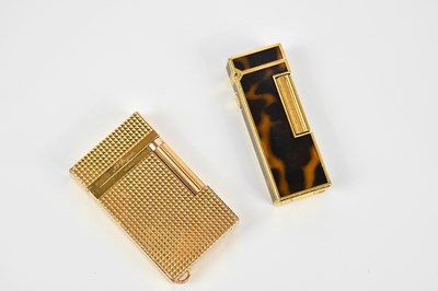 Lot 670 - S J DUPONT; a gold plated cigarette lighter...