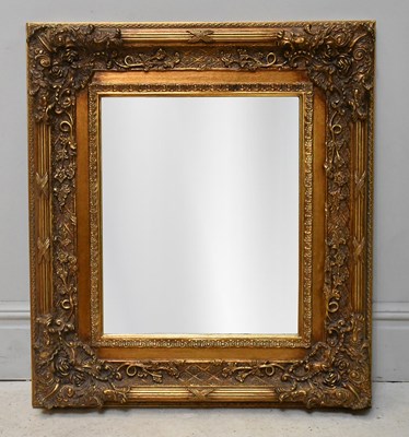Lot 25 - A decorative gilt framed rectangular wall...