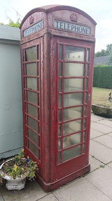 Lot 230 - An early 20th century red painted telephone...