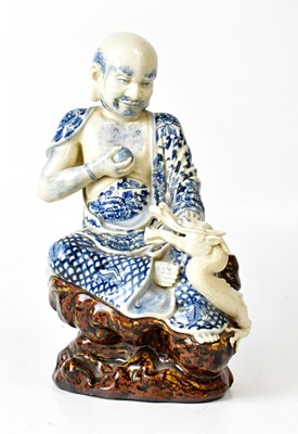 Lot 352 - A Chinese blue and white porcelain figure of a...