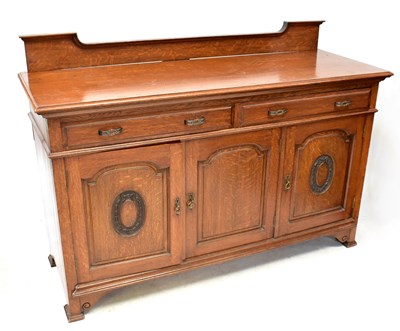 Lot 35 - An early 20th century oak sideboard, with two...
