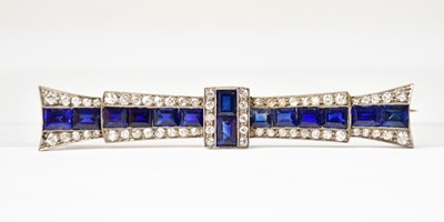 Lot 830 - An Art Deco yellow metal bar brooch modelled...