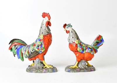 Lot 214 - A pair of porcelain models of a cockerel and a...