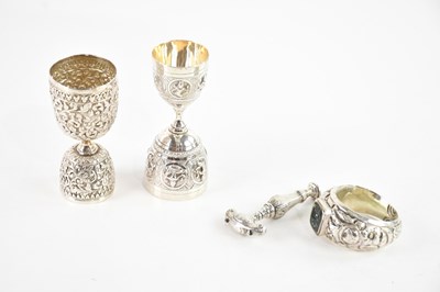 Lot 579 - A collection of Eastern white metal items...