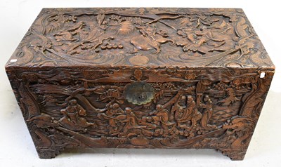 Lot 345 - A Chinese carved camphor wood chest, profusely...