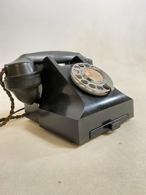 Lot 80 - A vintage black telephone with drawer to the...